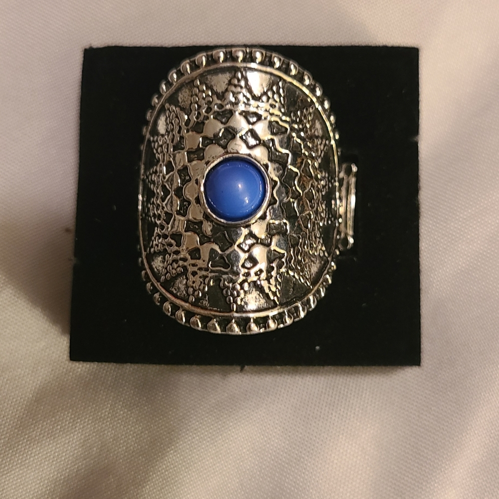 Silver Ring with blue in the center.
